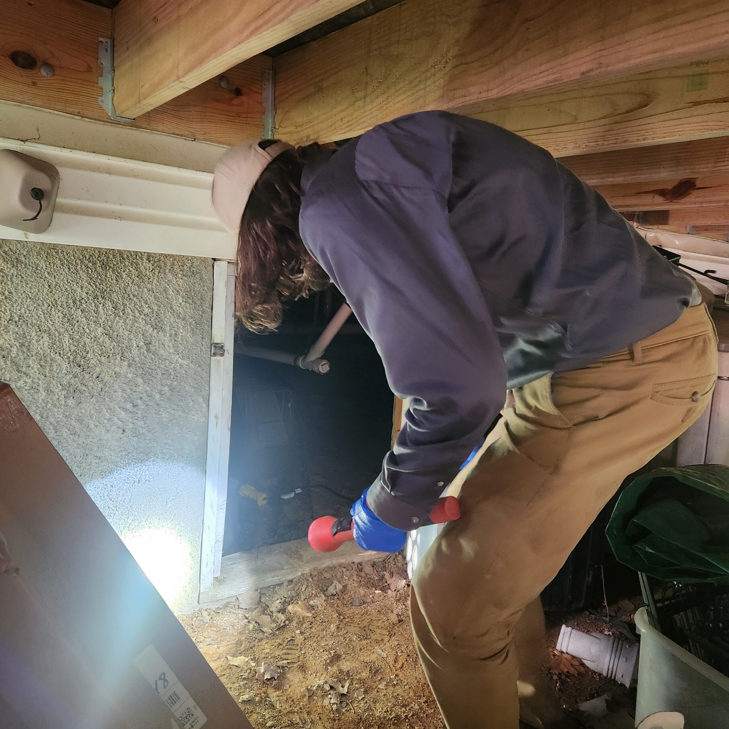 Jack Deck Tech Inspecting Crawlspace